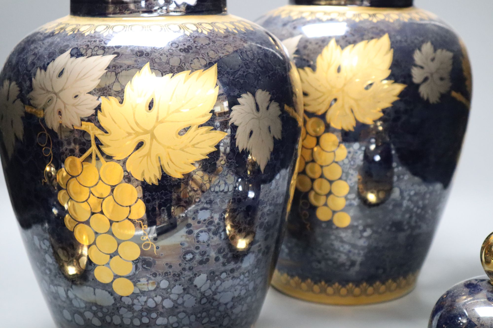 A pair of Artlynsa lustre and gilt decorated vases, height 43cm